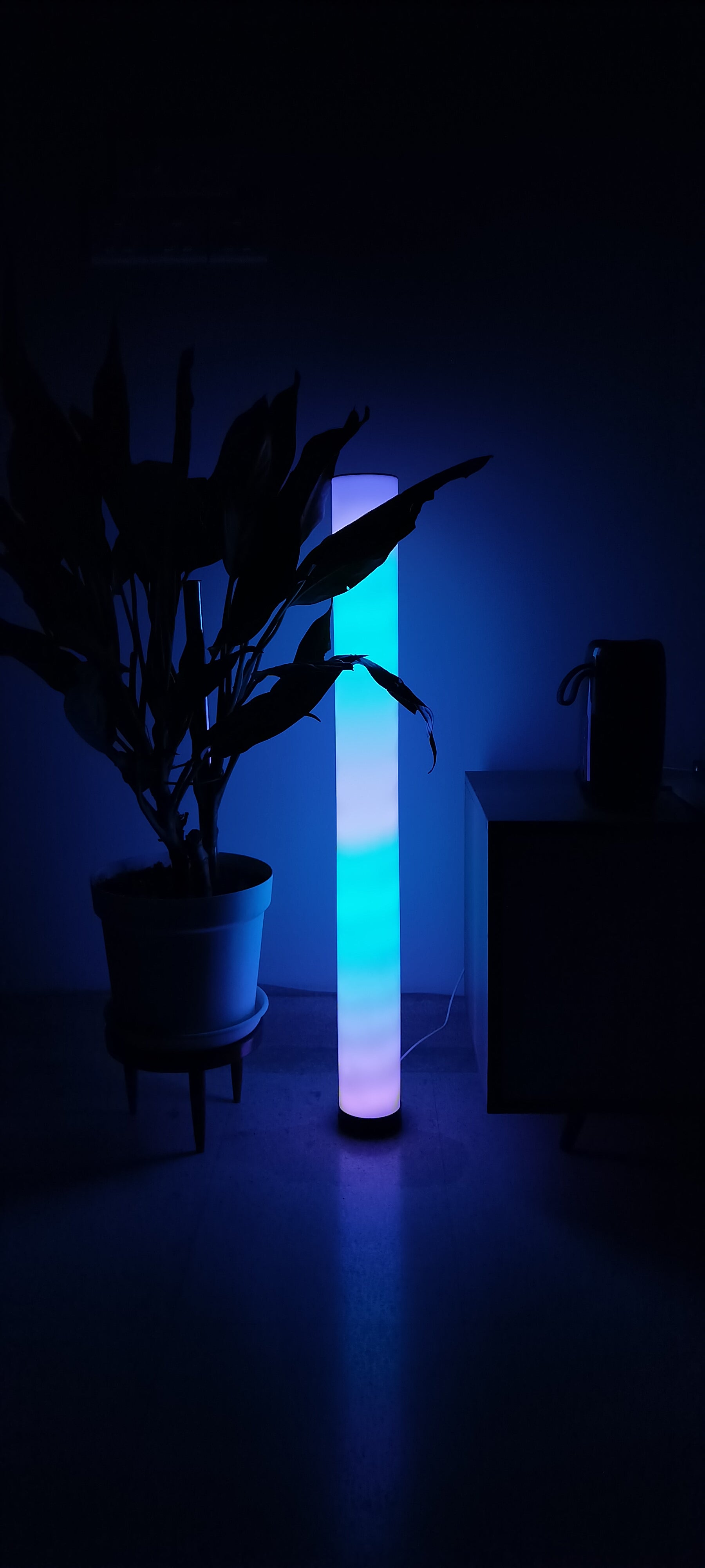 GLO Orbit LED light with a modern, sleek design and customizable color settings, ideal for creating ambient lighting effects in your home.